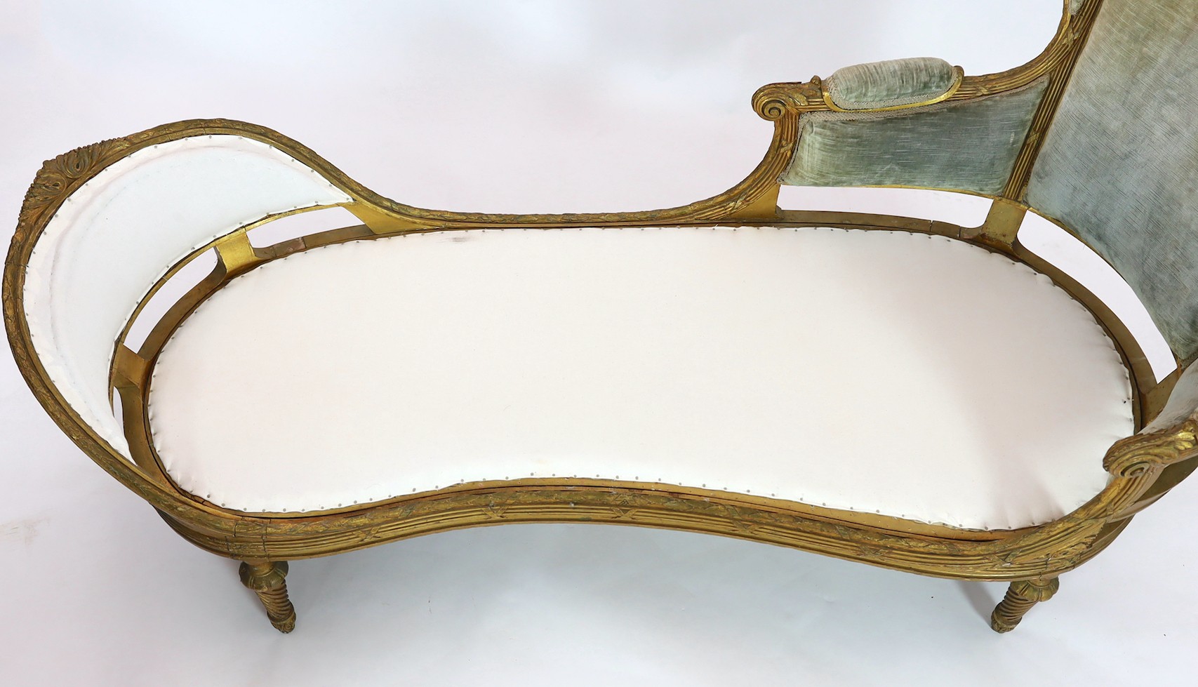 A 19th century Louis XVI style giltwood chaise longue, length 186cm depth 76cm height 95cm